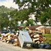 air conditioners flooded in thousands of homes in Houston during Hurricane Harvey flood debris piles on residential street