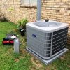 residential air conditioning repair unit being serviced